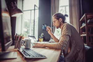 Male Freelancer sitting at desk